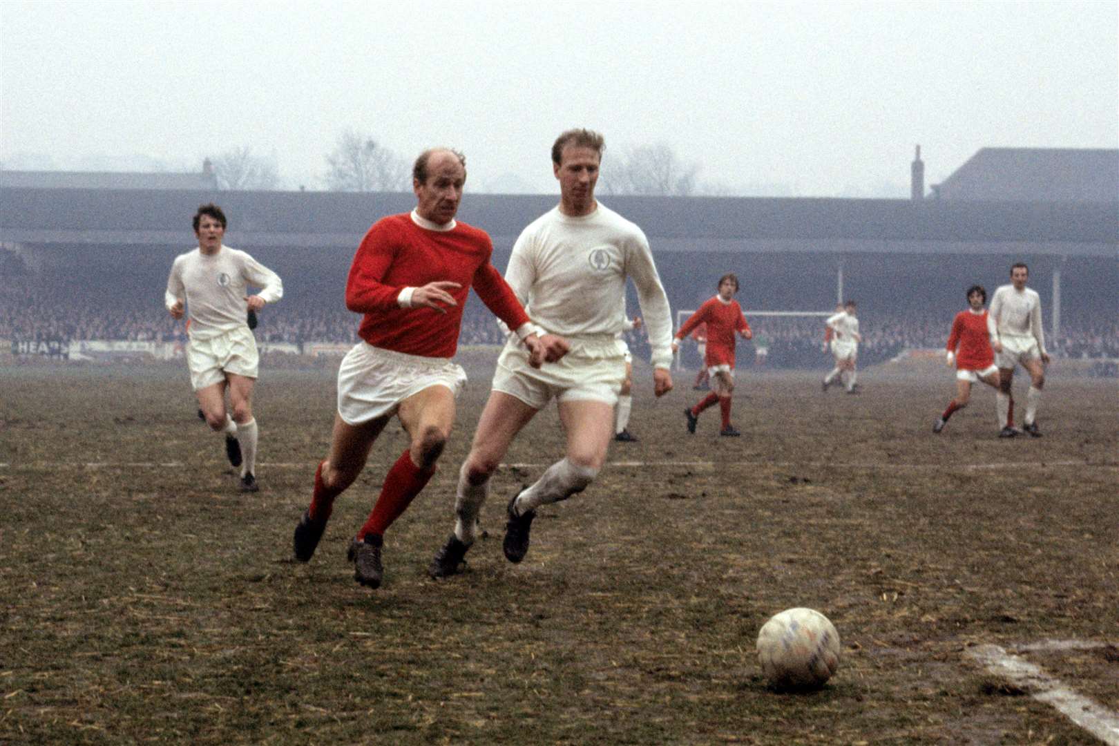 Brothers Bobby and Jack Charlton playing for Manchester United and Leeds (PA)