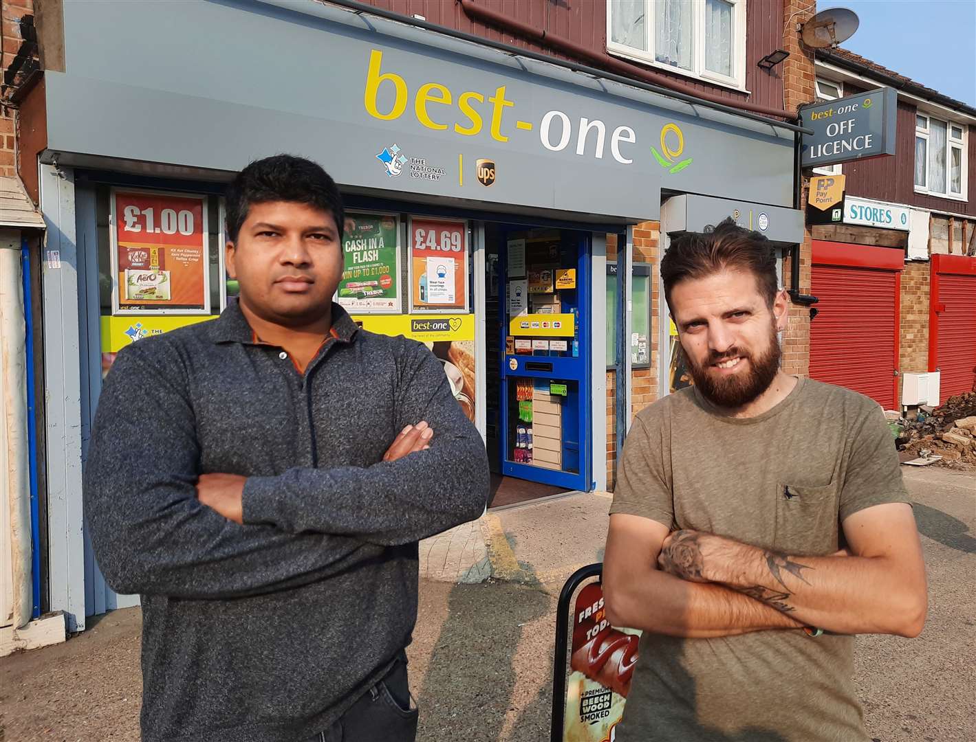 Best-One owner Velupillai Niroshan, left, says about a quarter of pupils who enter his shop don't wear masks