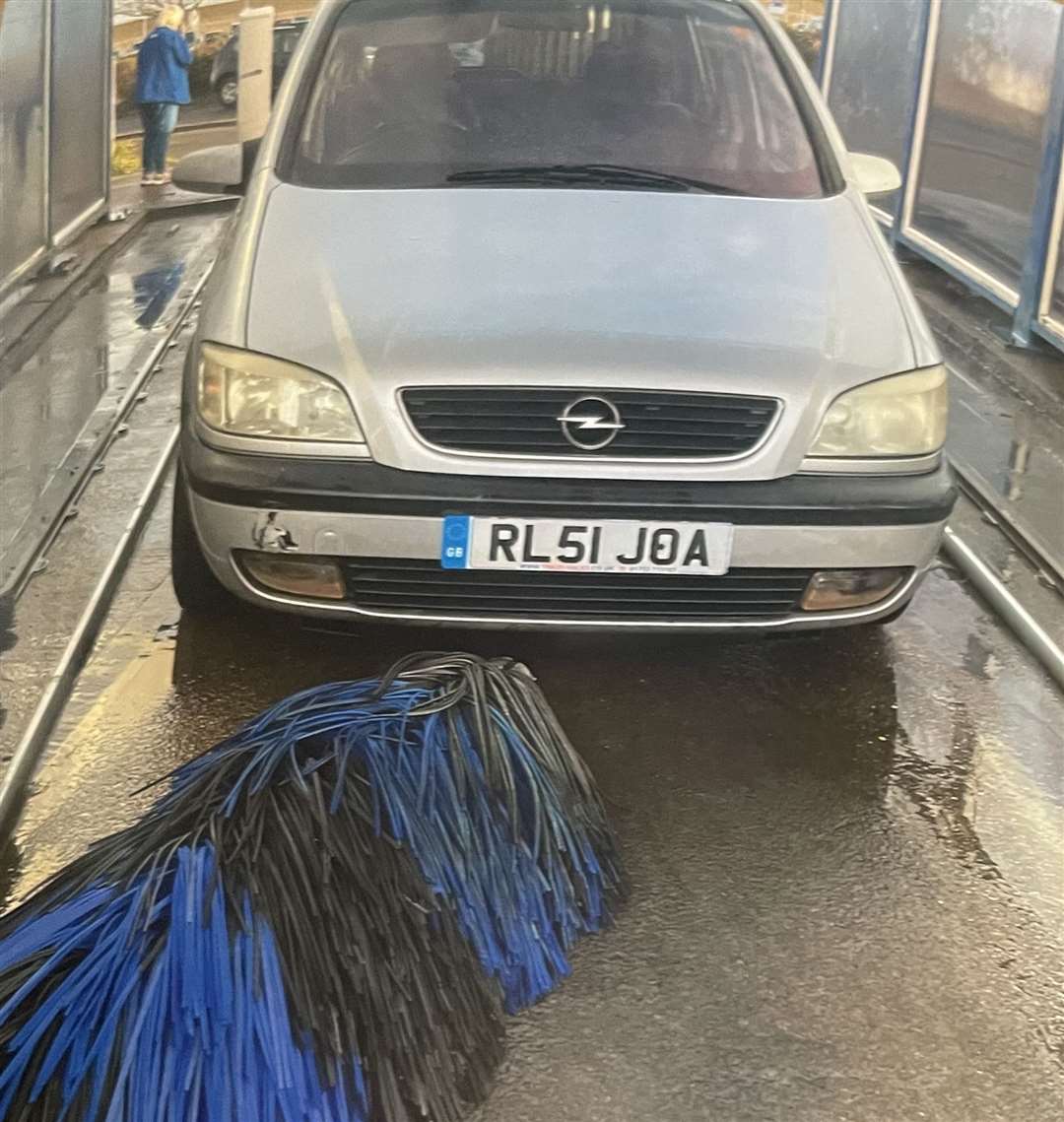 A car wash arm fell on top of Terry's car