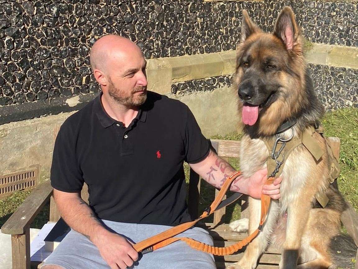 University of Kent lecturer Dr Simon Gellar brings Wolf to work to support him with his pain and anxiety. Picture: Simon Gellar