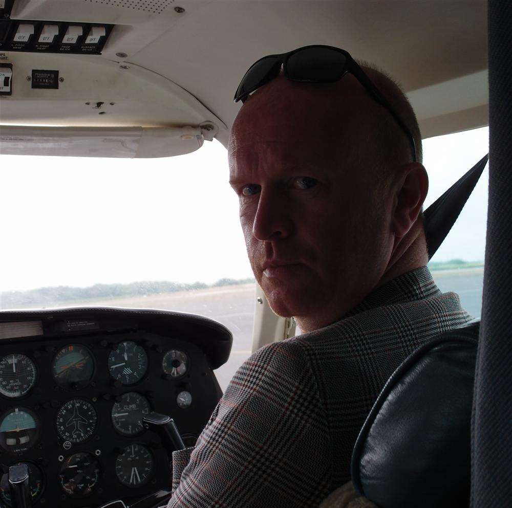 Nervous flyer Andy "enjoying" his flight across the Channel.