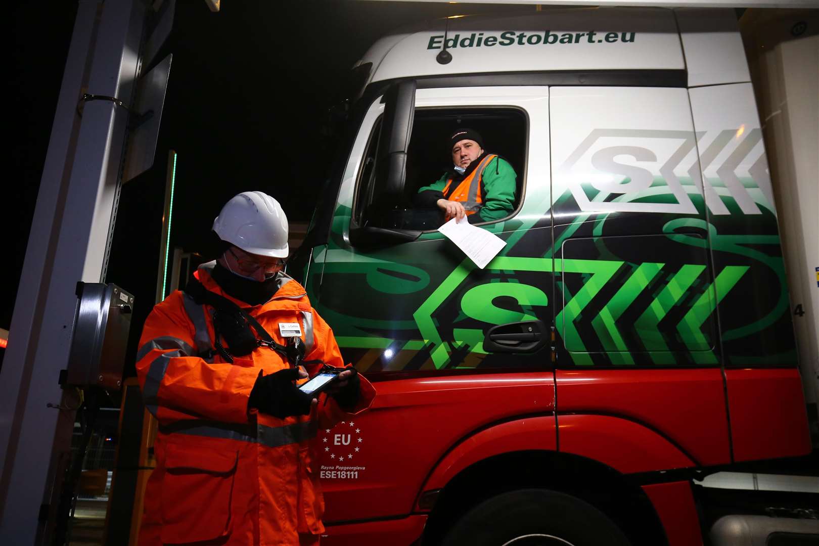 The first lorry, driven by Slavi Ivanov Shumeykov, loads on to Le Shuttle at the Eurotunnel in Folkestone, Kent, after the UK leaves the single market and customs union (Gareth Fuller/PA)