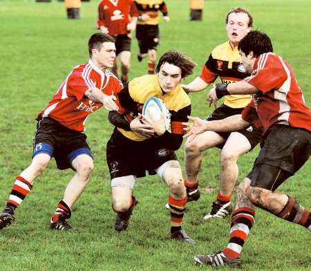 Full-back Brian Cowie, scorer of Ashford’s first try, makes a break and, right, centre Joe Lakin braces himself for a tackle