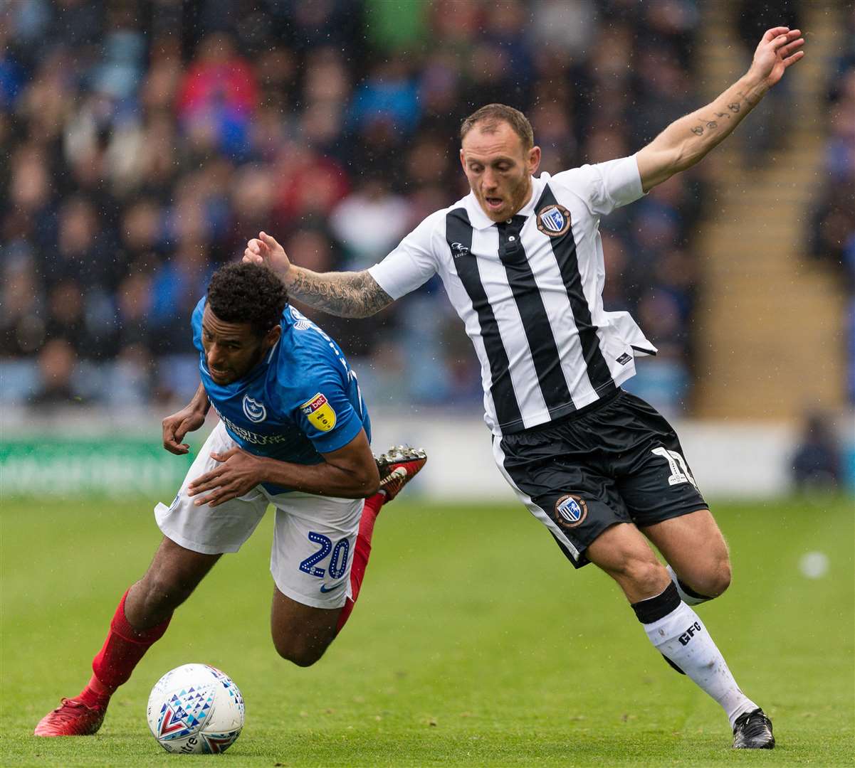 Barry Fuller tangles with Pompey's Nathan Thompson Picture: Ady Kerry
