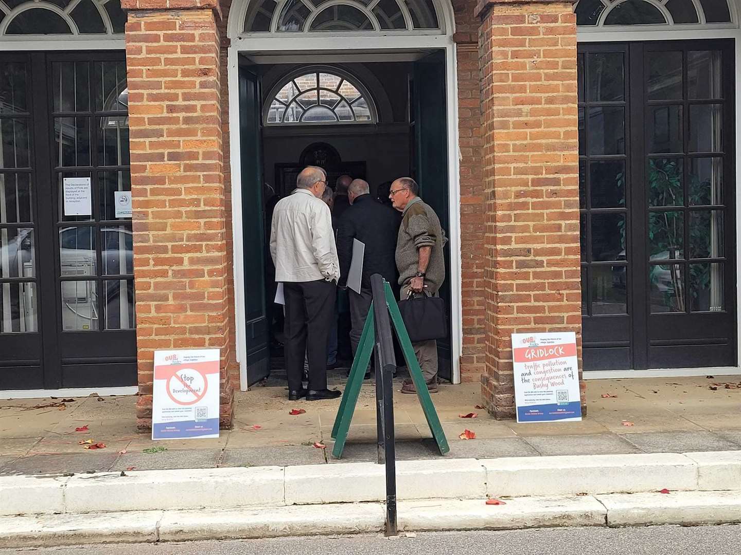 The public enters the council chamber in Kings Hill where the hearing was held