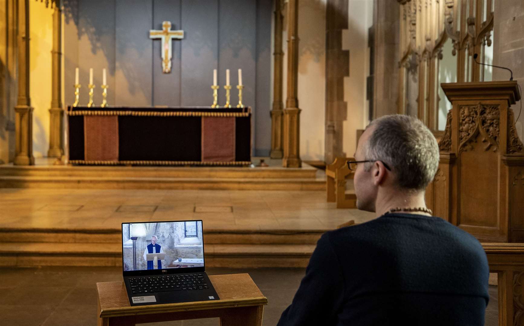 A parishioner watches the Church of England’s first virtual Sunday service given by the Archbishop of Canterbury Justin Welby (Peter ByrnePA Wire)