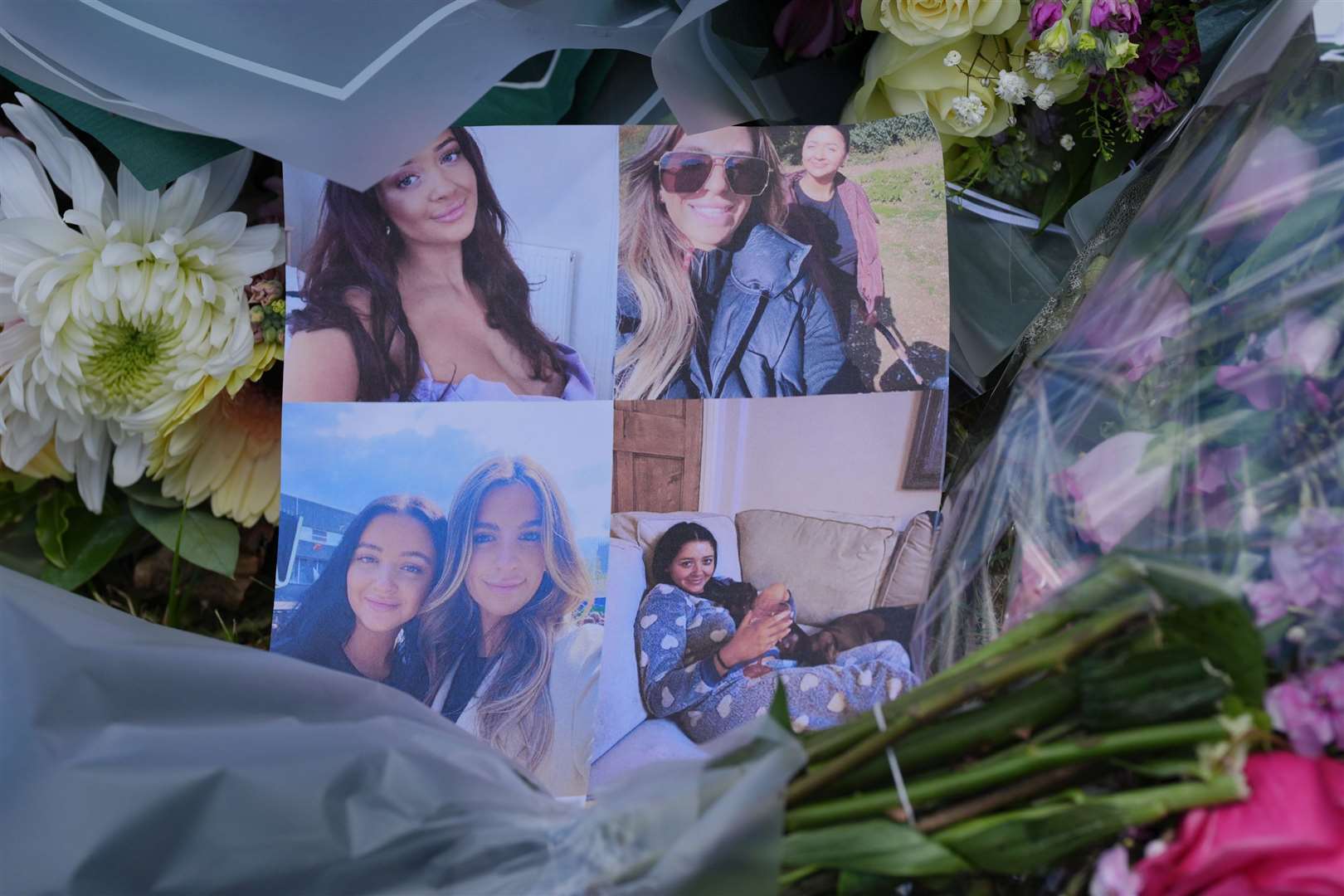 Pictures left on floral tributes at Ashlyn Close (Jonathan Brady/PA)