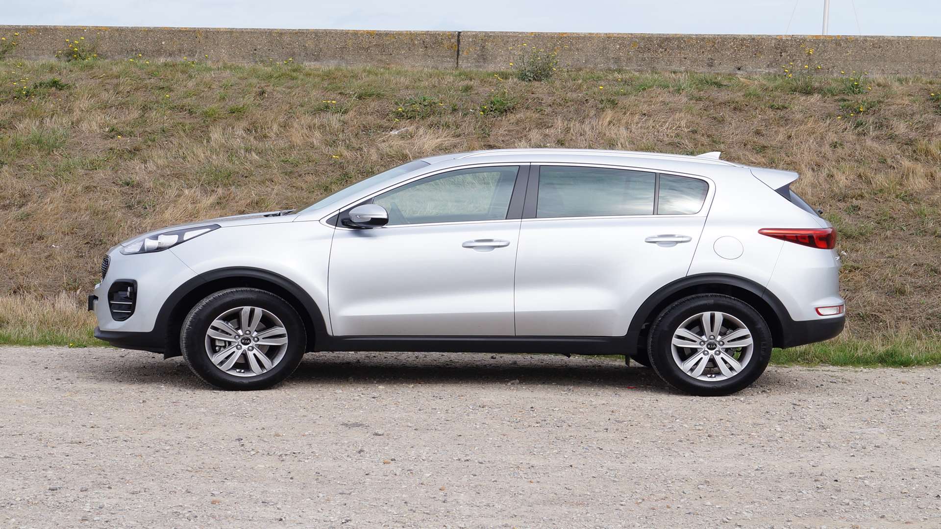 The swooping roofline and bulging wheel arches are carried over from the previous model