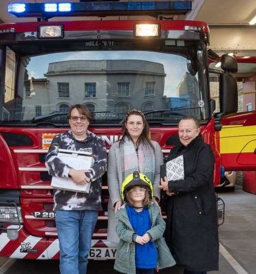 The Scrivens family of Herne Bay with fireman Albert Scriven's' photo album. Picture courtesy of Kent Fire and Rescue Service