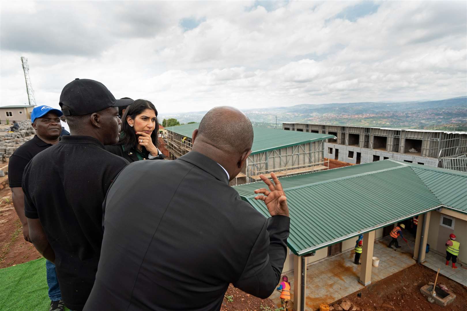 Home Secretary Suella Braverman views houses being constructed that could eventually house deported migrants in Rwanda (Stefan Rousseau/PA)