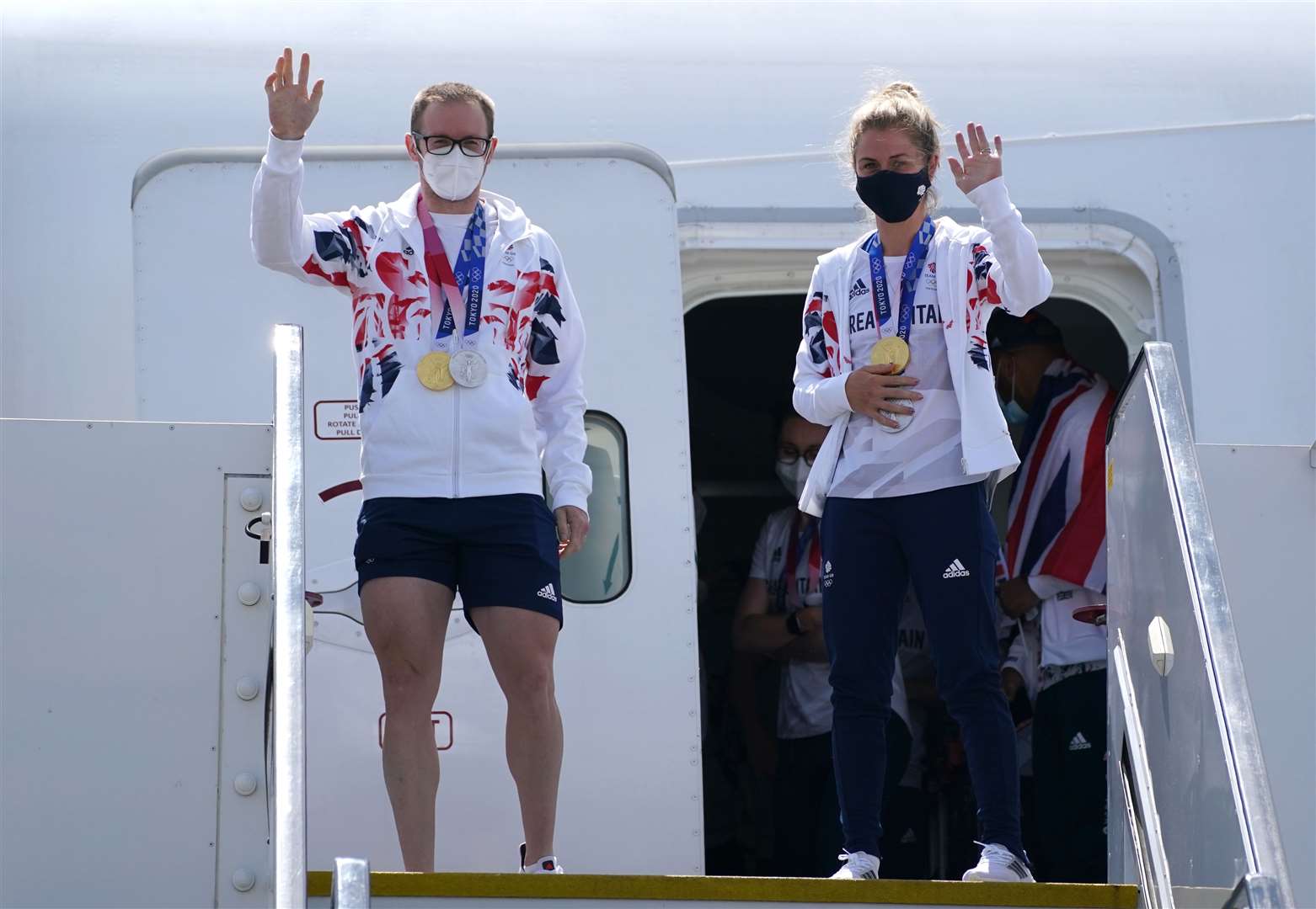 Jason and Laura Kenny arrive at Heathrow after the Tokyo Games (Steve Parsons/PA)