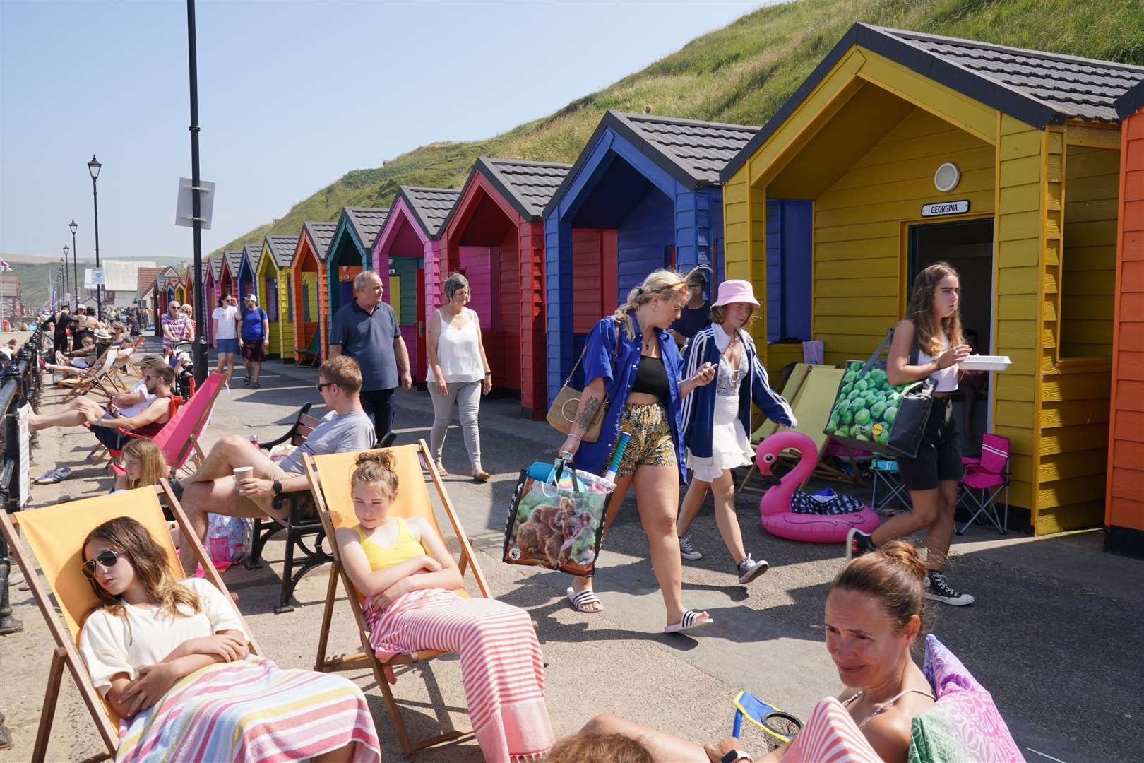 People by the beach at Saltburn-by-the-Sea in North Yorkshire (Owen Humphreys/PA)