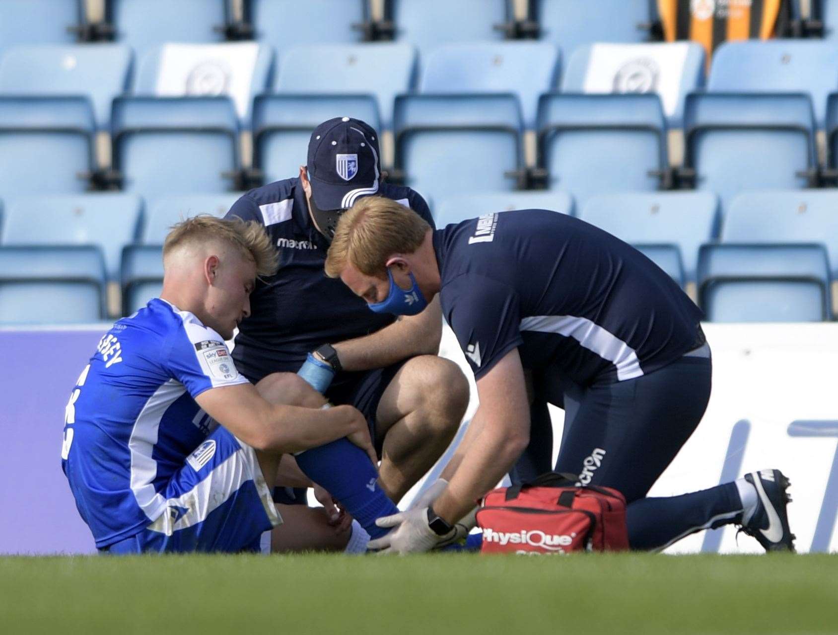 Kyle Dempsey receives treatment after suffering an ankle injury Picture: Barry Goodwin