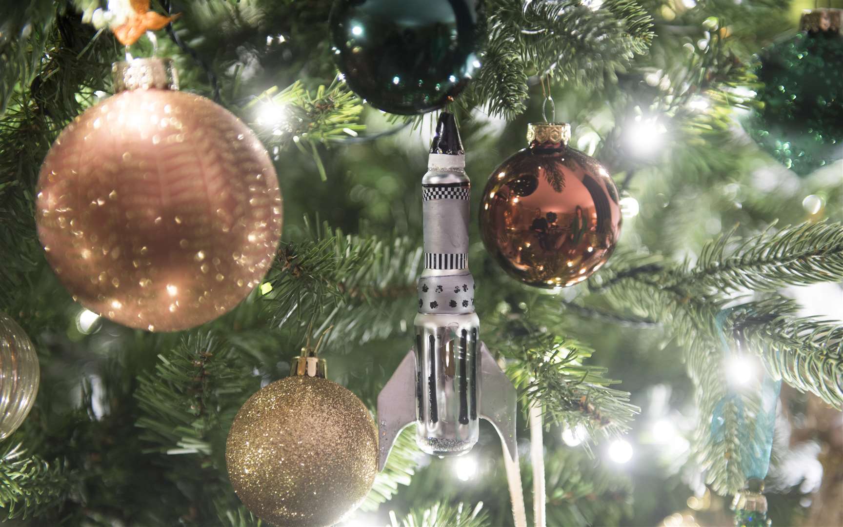 A rocket bauble on the John Lewis & Partners Christmas tree