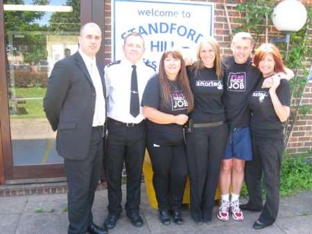 Dave Milner, head of security, with a prison officer and members of RAPt at the event for prisoners