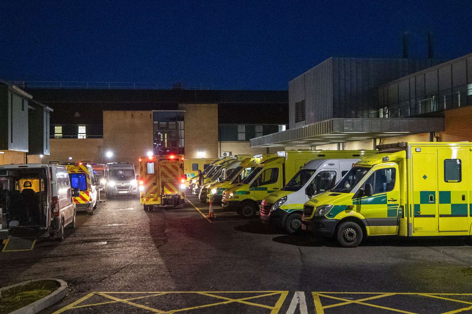 Ambulances at the entrance to the emergency department with a number of the vehicles with patients awaiting to be admitted at Antrim Area Hospital (Liam McBurney/PA)