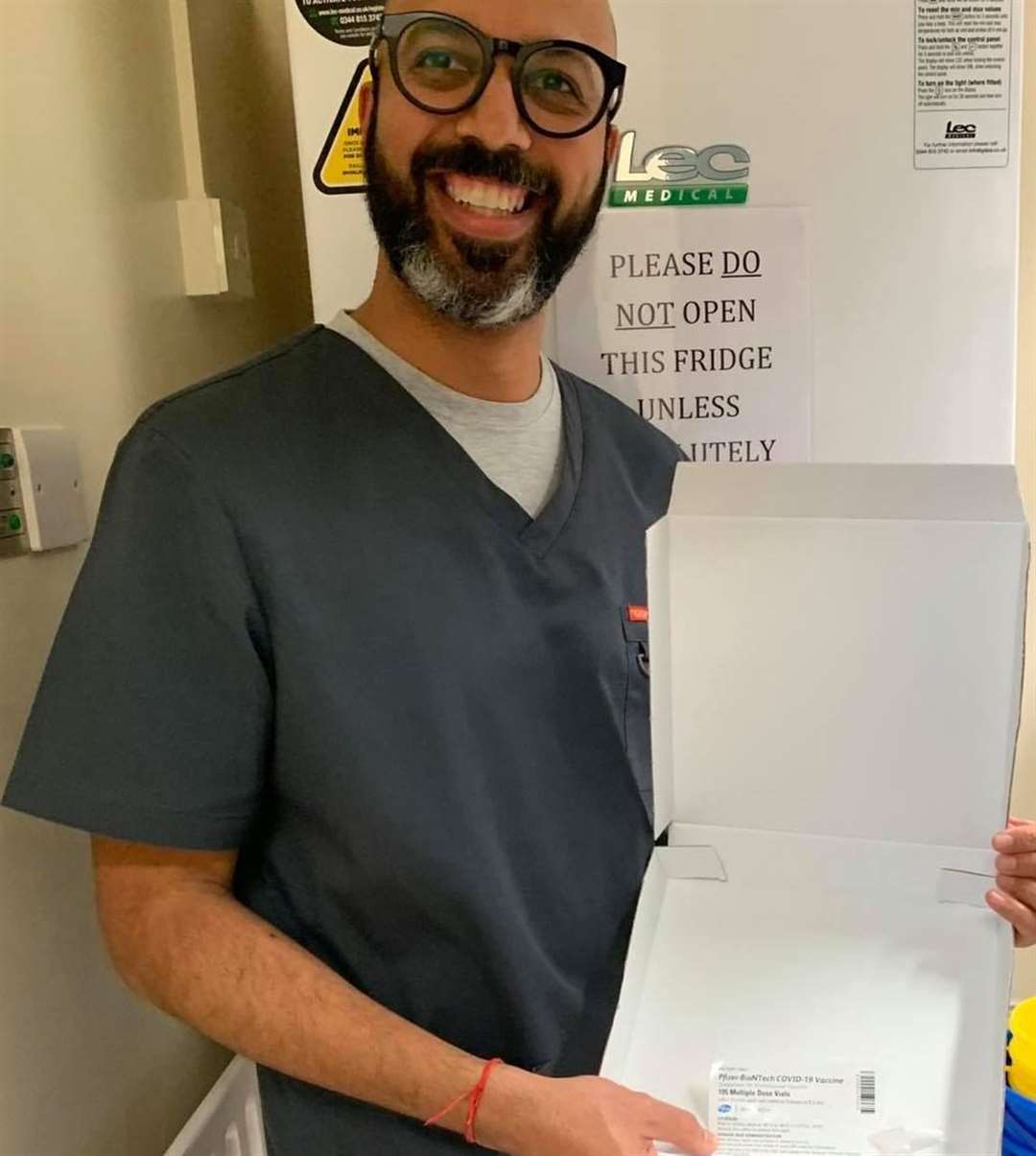 Dr Gaurav Gupta with the Pfizer/BioNTech vaccine. Picture: Faversham Medical Practice