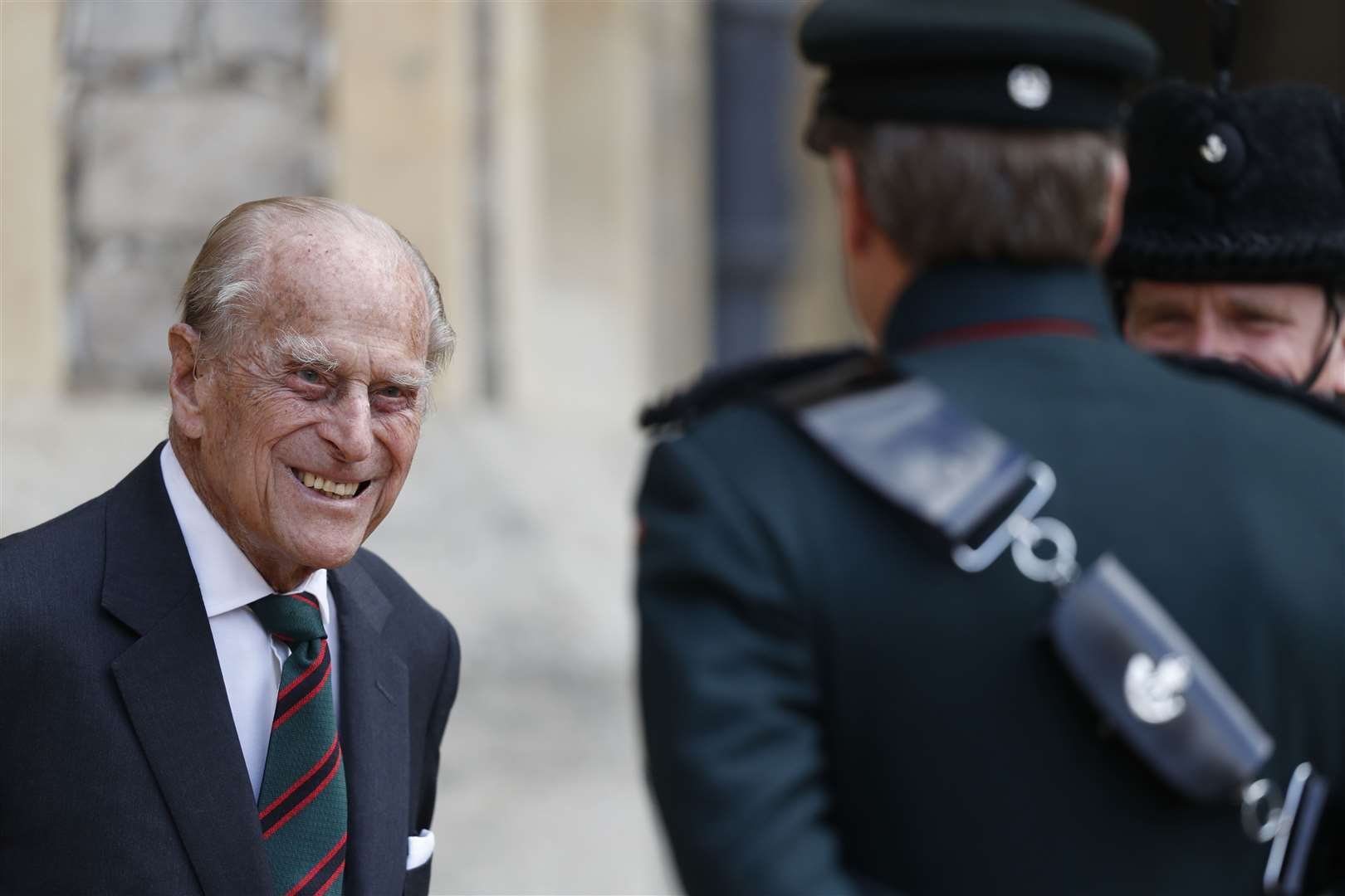 The Duke of Edinburgh speaks to a bugler at Windsor Castle during a ceremony for the transfer of the Colonel-in-Chief of The Rifles to Camilla (Adrian Dennis/PA)