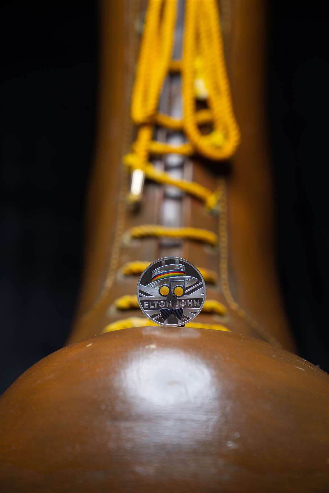 The coin sits on the singer’s famous boots worn as part of his Pinball Wizard costume in the 1975 film Tommy (Casey Gutteridge/The Royal Mint/PA)