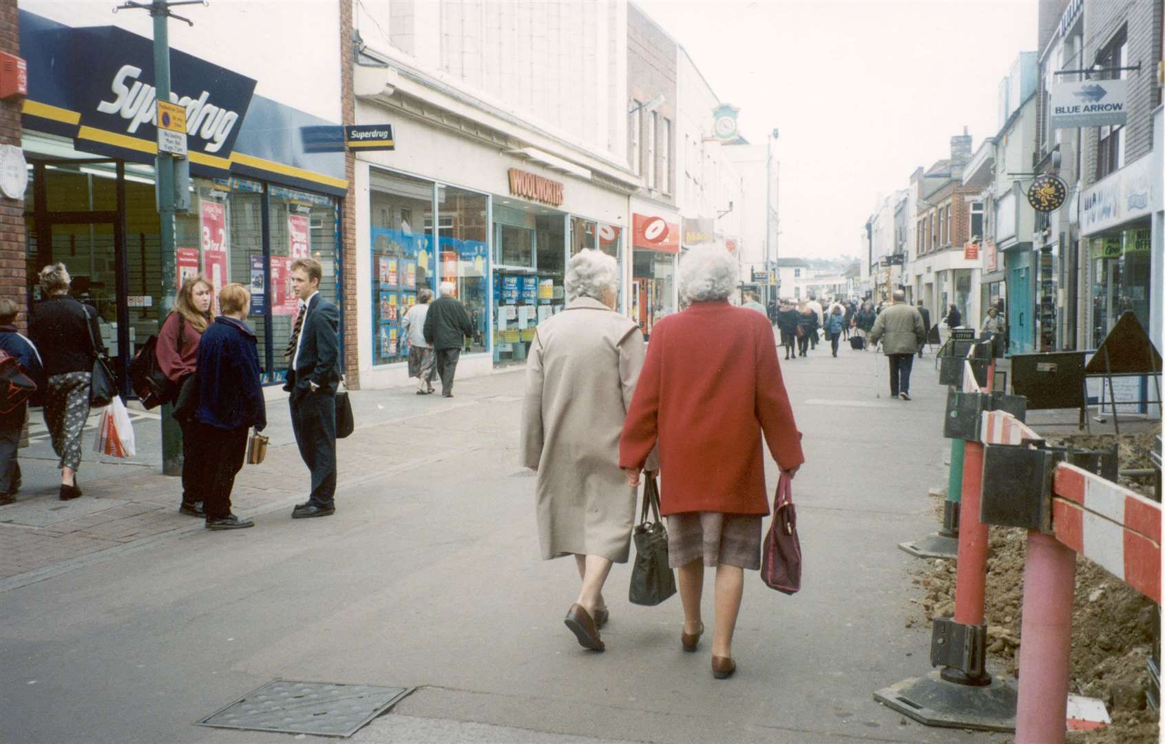 Shoppers stroll past Superdrug and Woolworths in Week Street, Maidstone, in 1996. Woolworths is now occupied by a Poundland and a Deichmann store