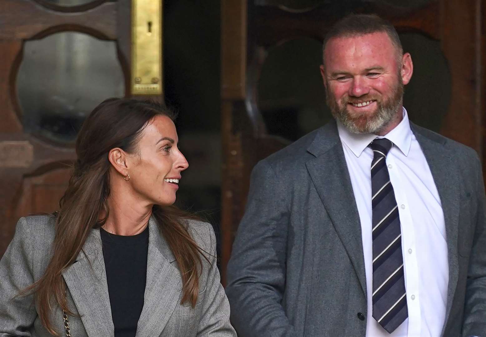 Coleen and Wayne Rooney leaving the Royal Courts Of Justice during the trial (Yui Mok/PA)