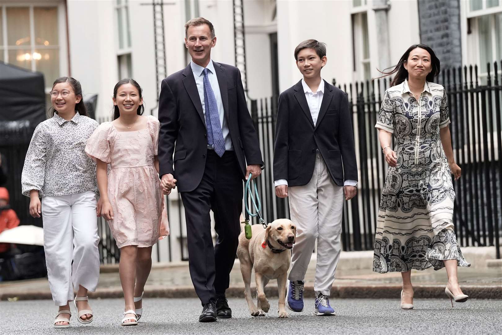 Outgoing Conservative chancellor of the exchequer Jeremy Hunt, with his wife Lucia and their children Jack, Anna and Eleanor, leaves 11 Downing Street (Stefan Rousseau/PA)