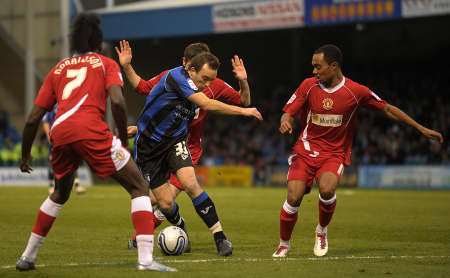 Newcomer Charlie Lee tries to battle his way through three Crewe players