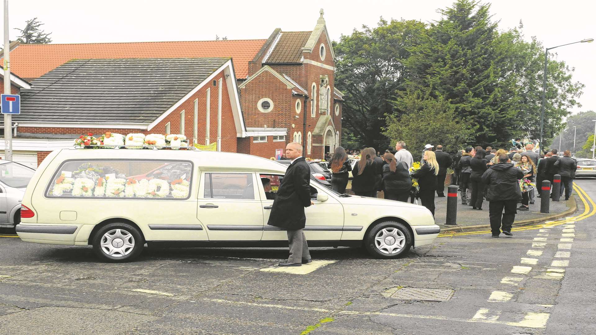 The hearse arrives at the church in Rochester