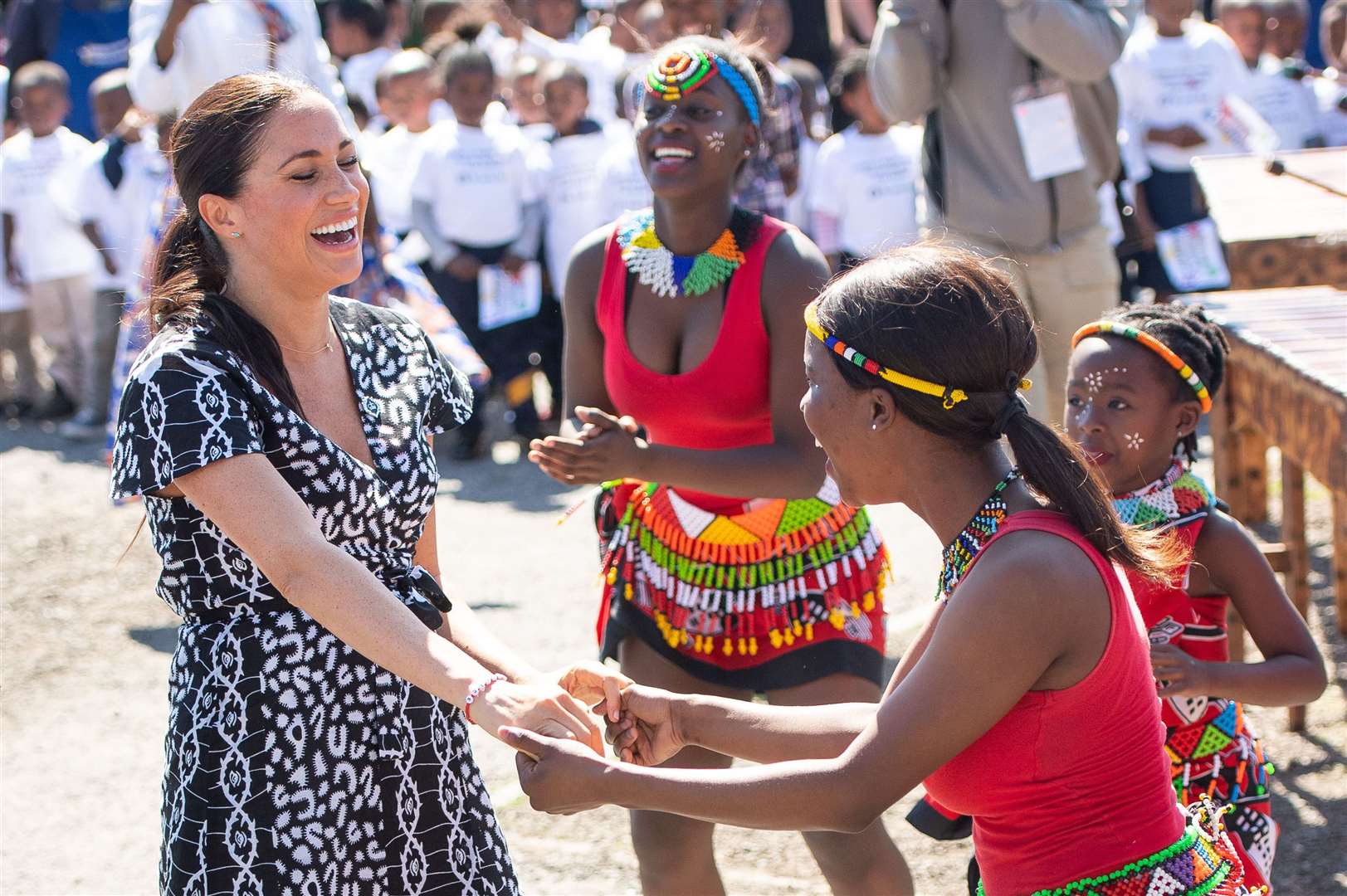 Meghan joined dancers at the Nyanga Township in Cape Town, South Africa (Dominic Lipinski/PA)