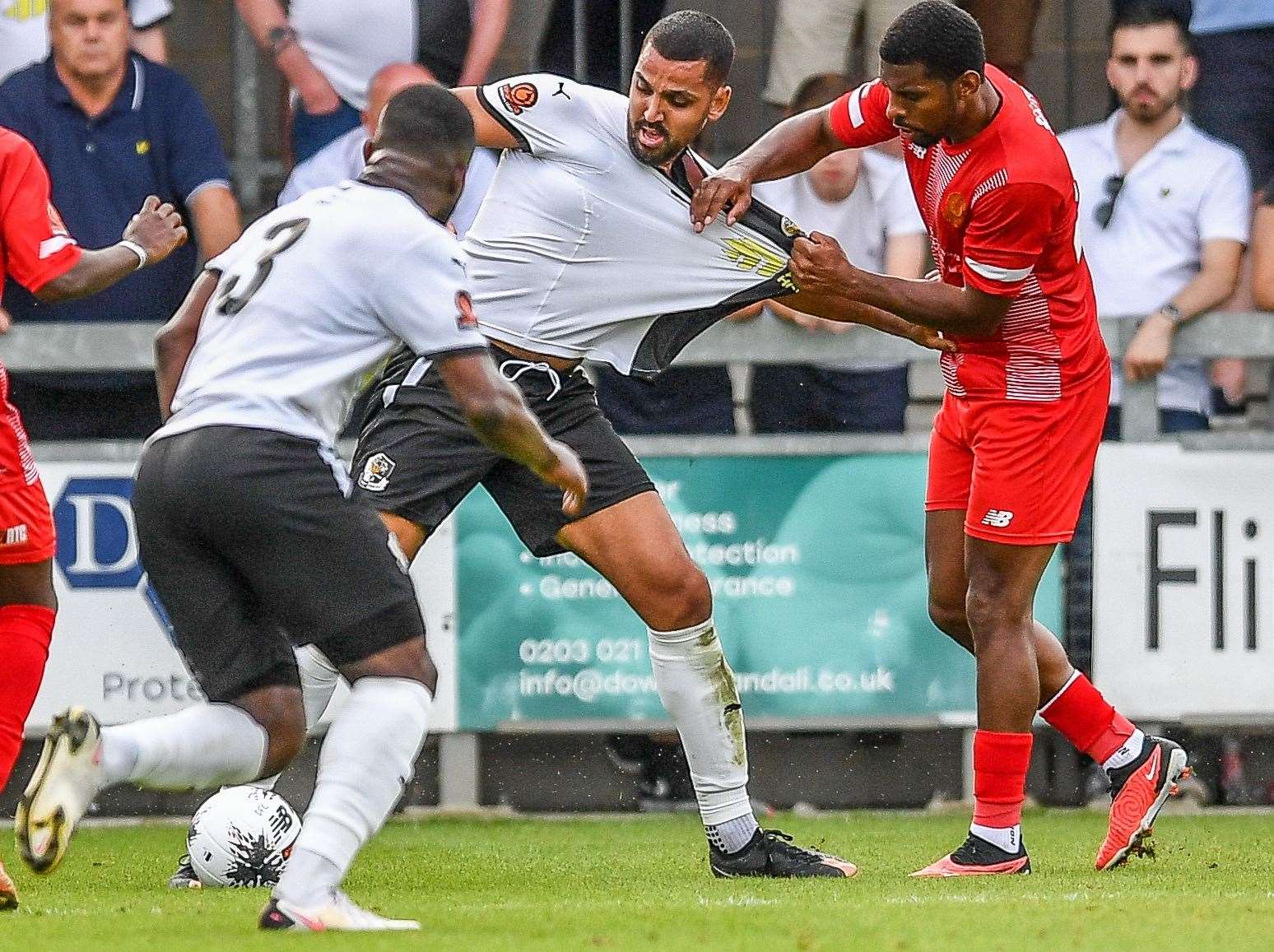 Dartford striker Lewis Manor is held back by Welling during last weekend’s FA Cup 3-2 exit. Picture: Dave Budden