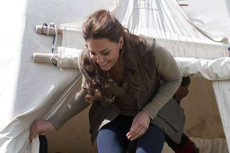 The Duchess of Cambridge exits one of the activity centre's teepee tents