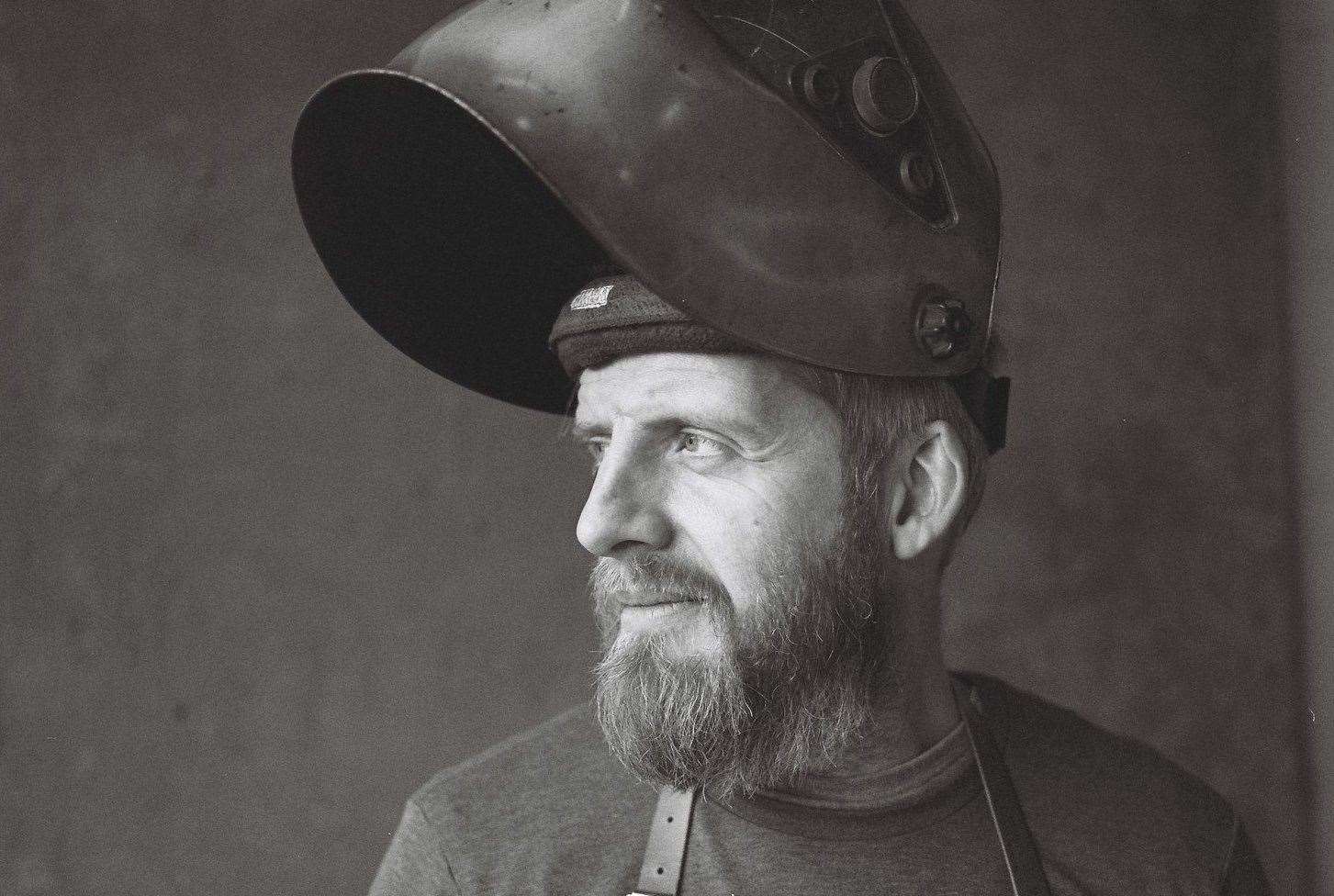 Dan Thumwood - in his welding gear - hand makes every oven at his Ramsgate workshop