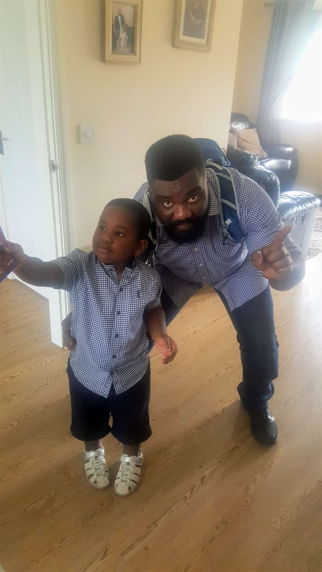 Charles Kwame Tanor with his four-year-old son, also called Charles (Prudence King/PA)