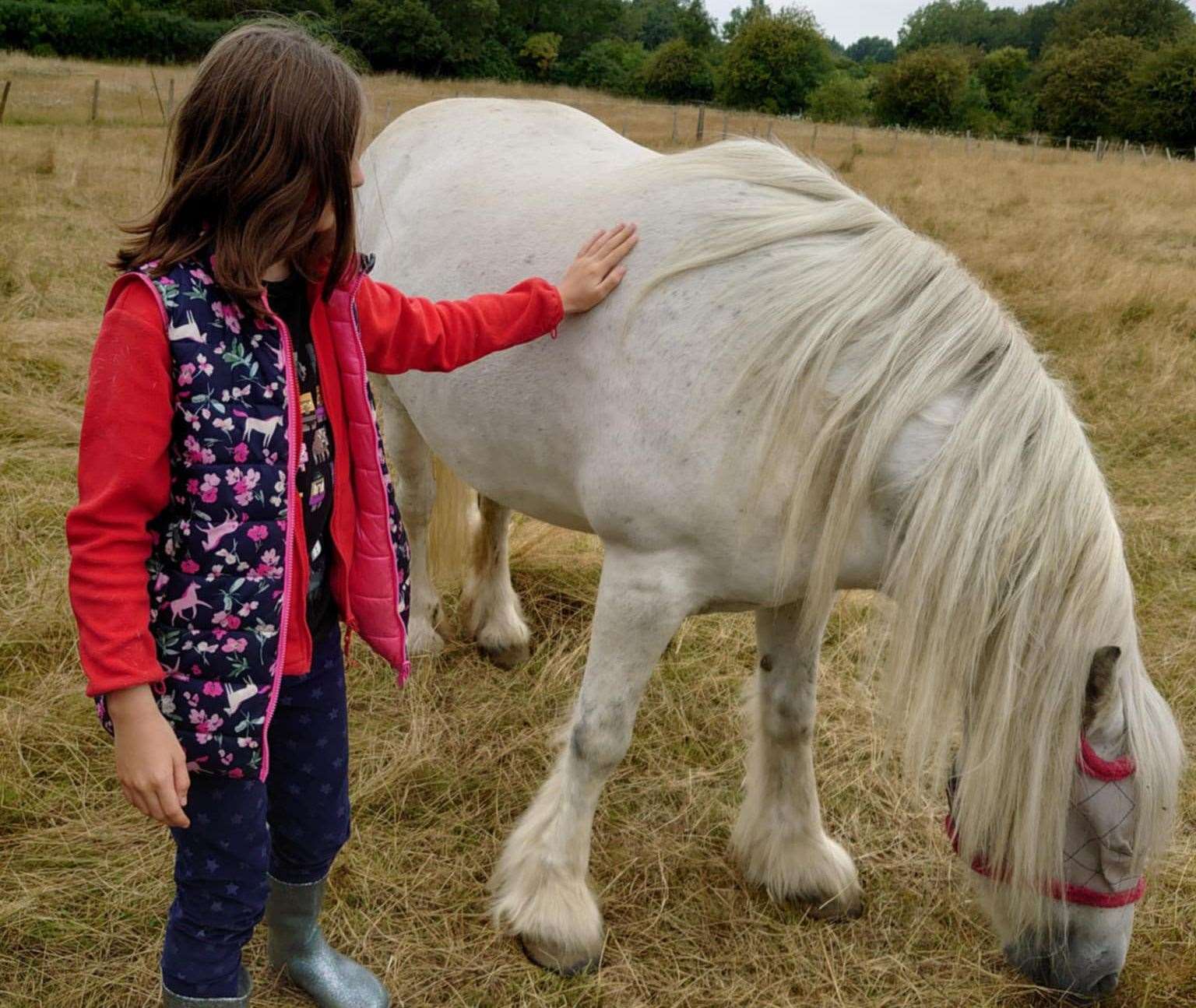 Wendy’s granddaughter with one of her beloved horses. Picture: Wendy McLaughlin