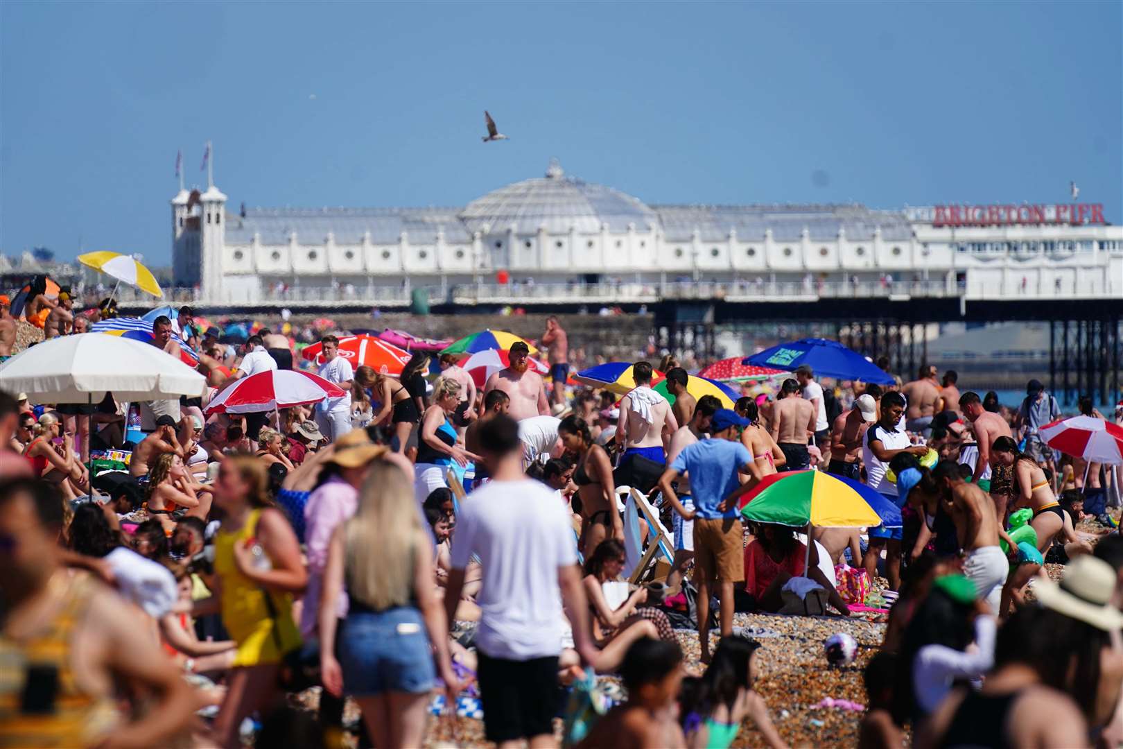 People enjoy the hot weather in Brighton (Victoria Jones/PA)