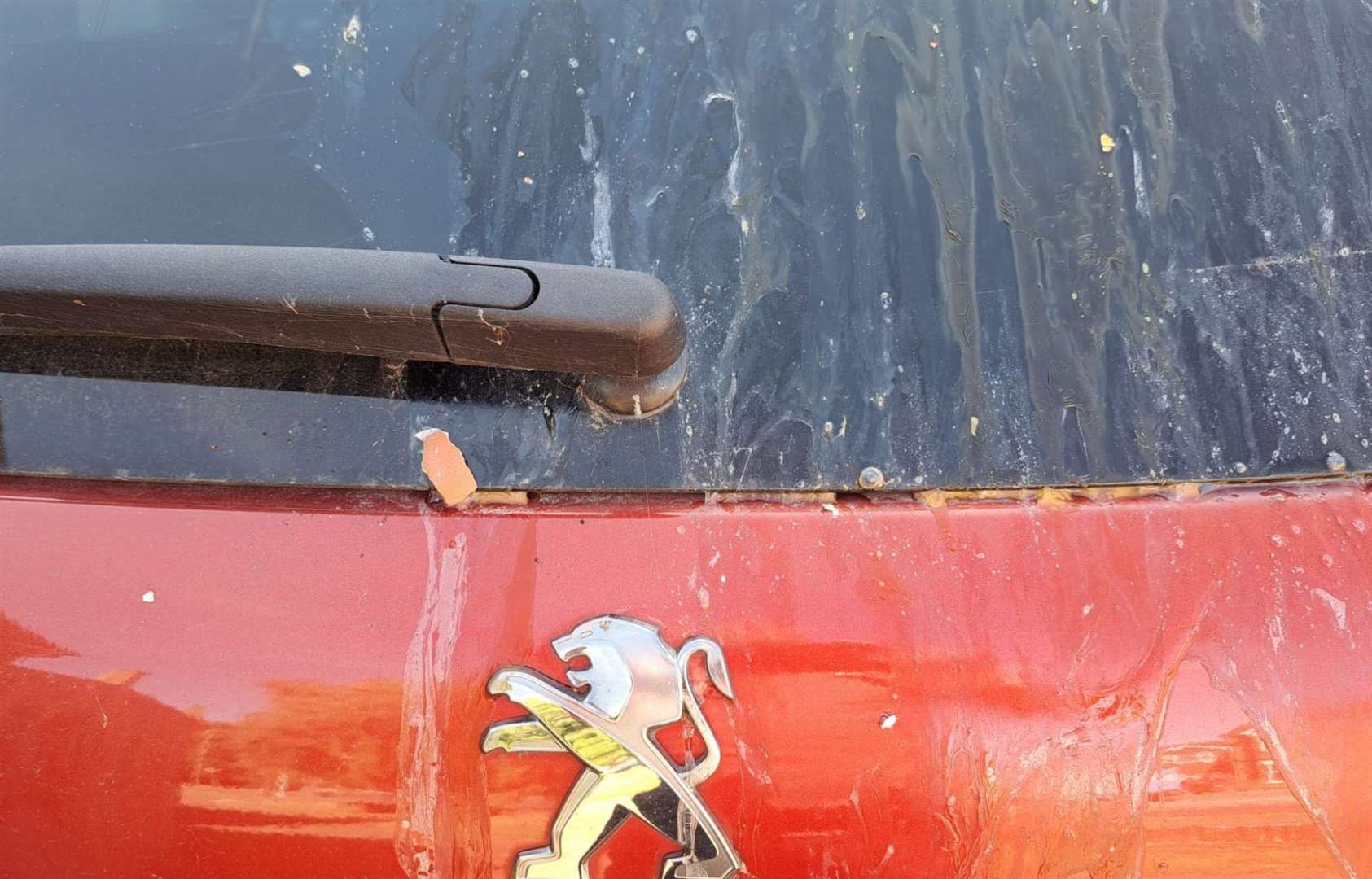 The mess left on the Peugeot 2008 after it was egged in Sainsbury's car park in Sittingbourne