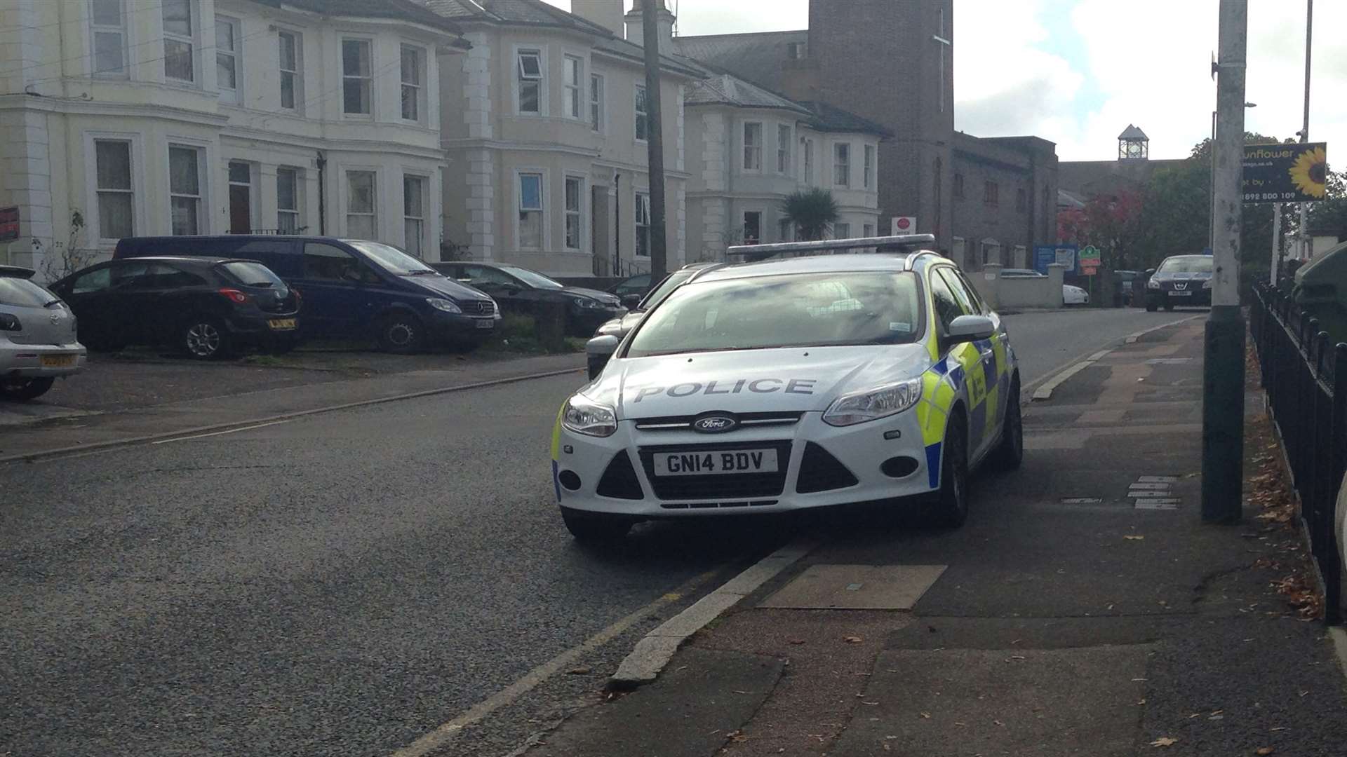 A police car outside the property