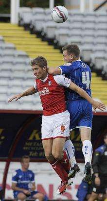 Charlie Lee wins the ball in the air against Rotherham