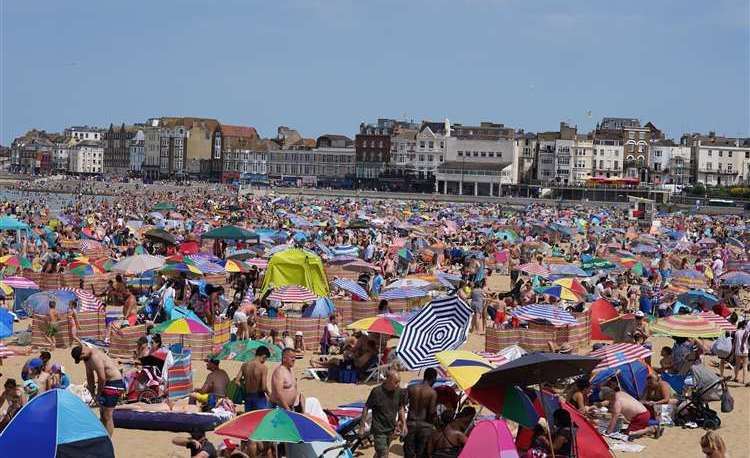People on a crowded Margate beach when temperatures have previously soared. Pic: Gareth Fuller/PA