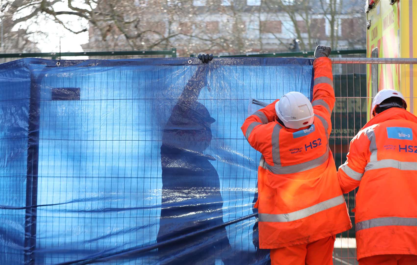 Tarpaulin is put up before the final anti-HS2 activist was removed (Luciana Guerra/PA)