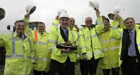 Transport Minister David Jamieson after making the first dig on the construction on the bridge and road, surrounded by staff from Carillion construction. Picture: PETER STILL