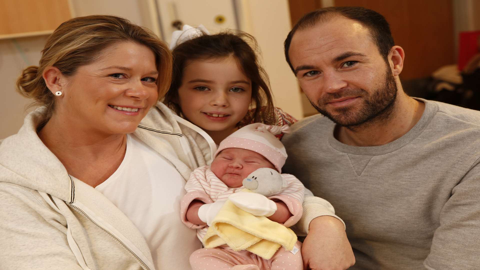 Alana Lee and Michael Phillips, from Harrietsham, with baby Nancy Victoria Phillips and older daughter Lacie. Picture: Matthew Walker