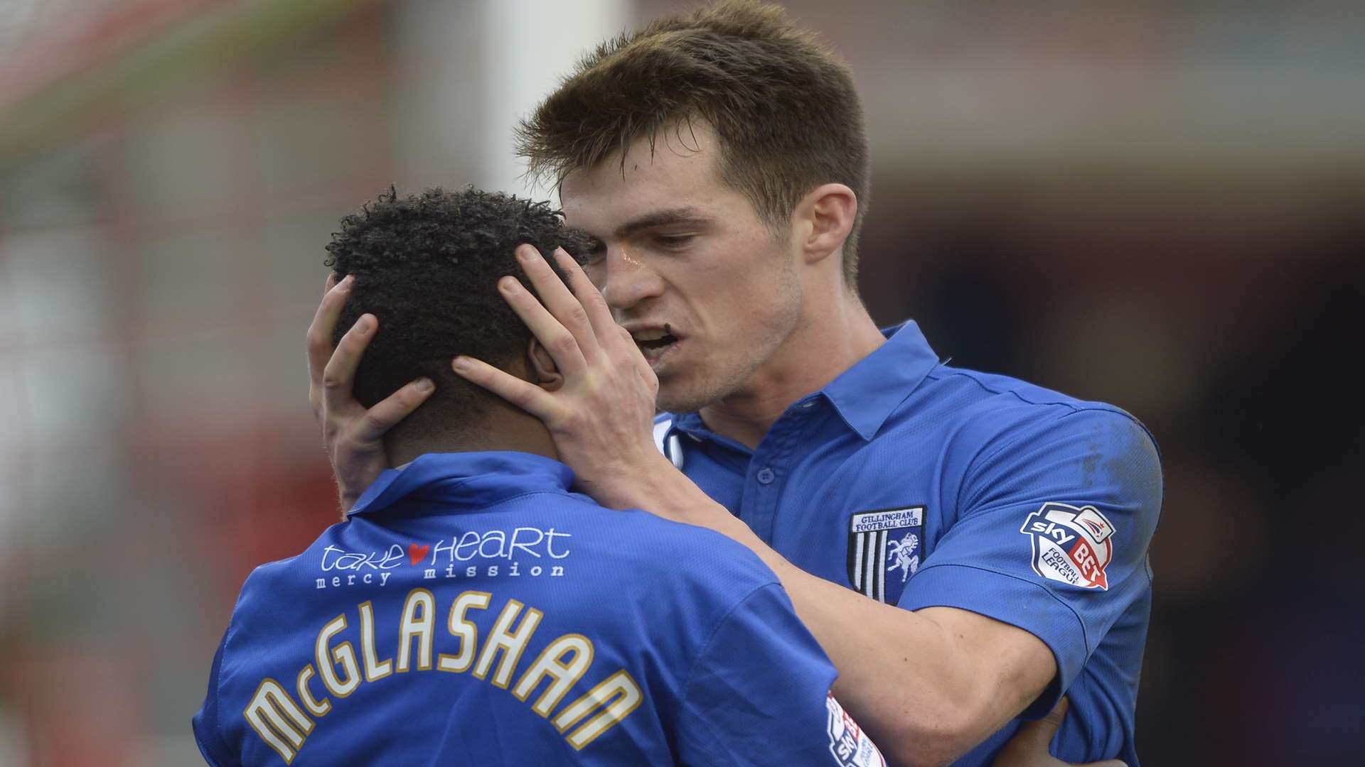 Jermaine McGlashan is congratulated by John Marquis after his winner at Crawley on Saturday Picture: Barry Goodwin