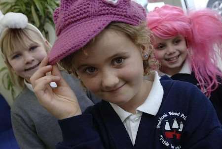 From left, Damaris Entwistle, Demie Risby and Hollie Nicholson at Caps For Kids Day, all eight years old. Picture: GRANT FALVEY