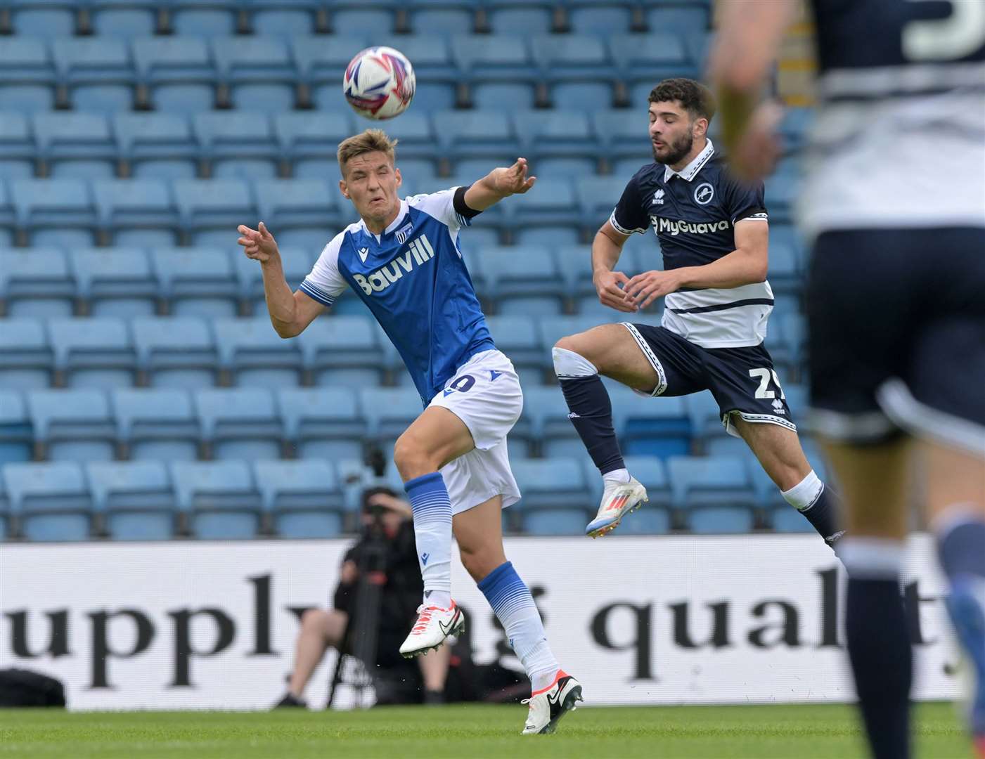 Elliott Nevitt challenges for the ball in Gillingham’s game against Millwall Picture: Keith Gillard