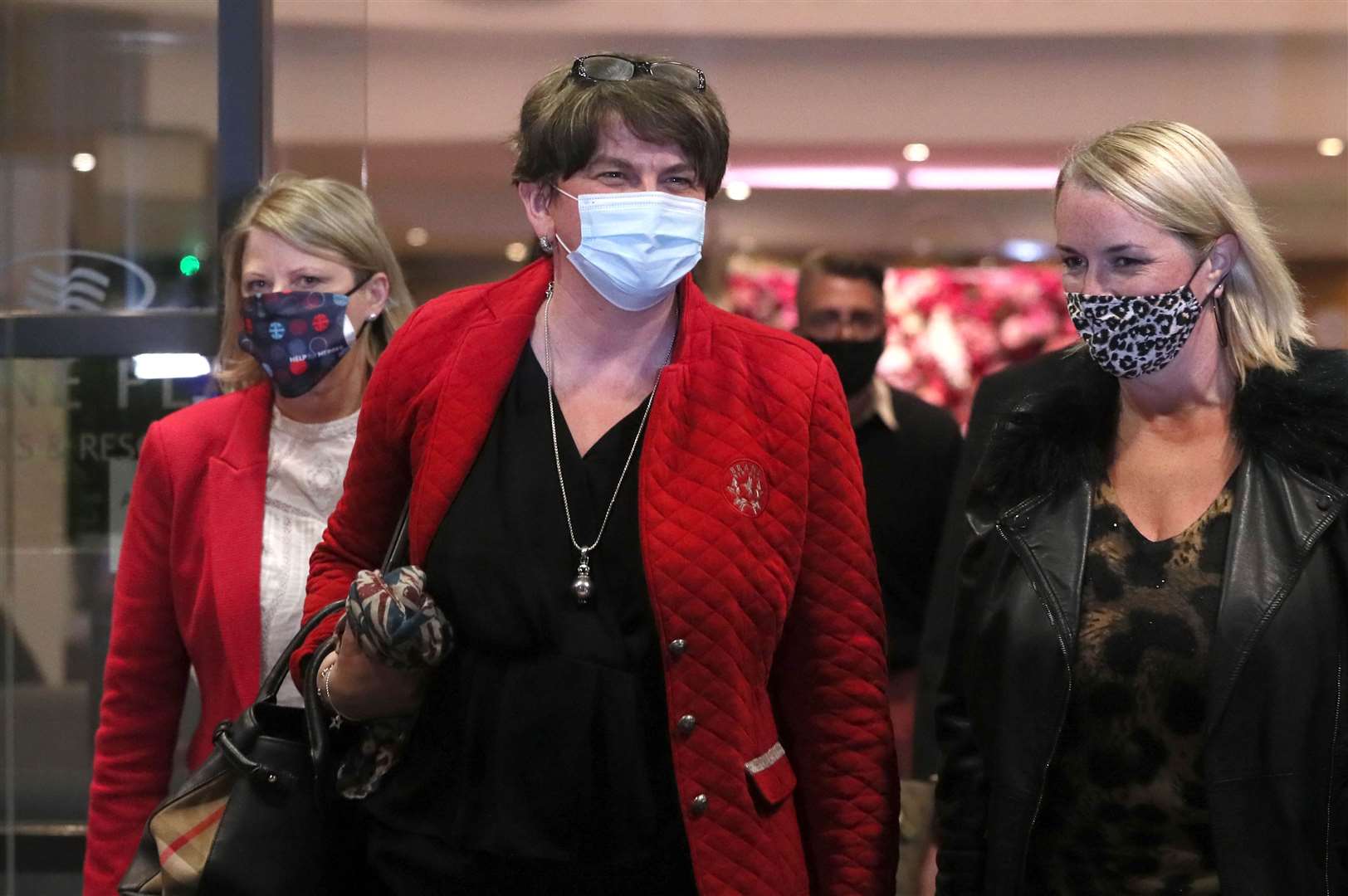 First Minister and outgoing DUP leader Arlene Foster (centre) leaving the Crowne Plaza Hotel during a meeting to ratify Edwin Poots as her successor (Brian Lawless/PA)