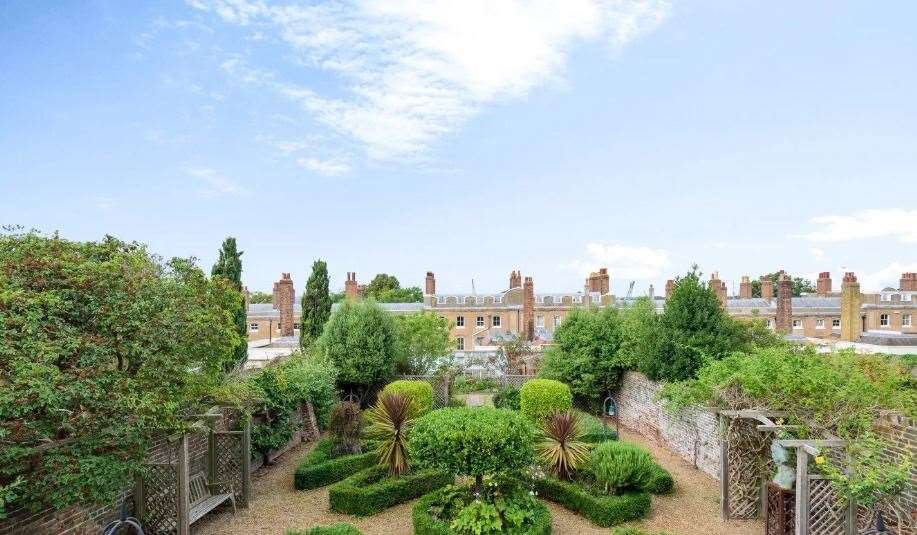 The well-maintained walled garden is filled with vibrant plants and shrubs. Picture: Fine and Country