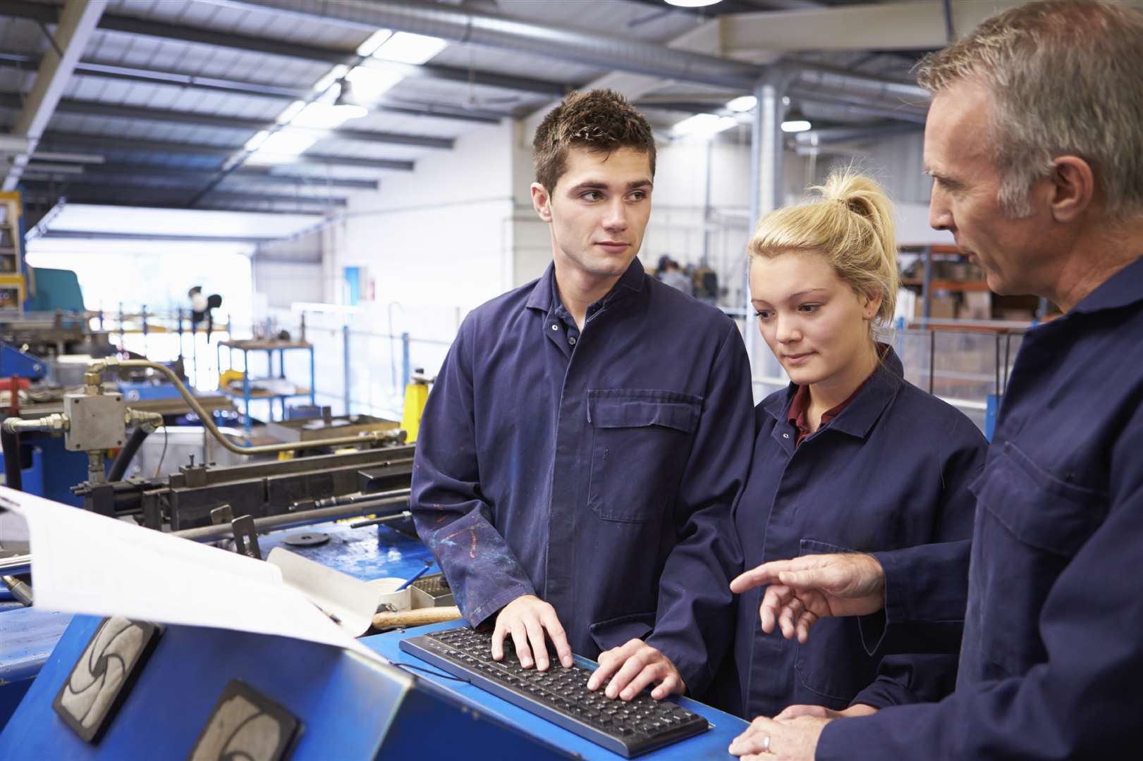 Engineer Teaching Apprentices To Use Tube Bending Machine