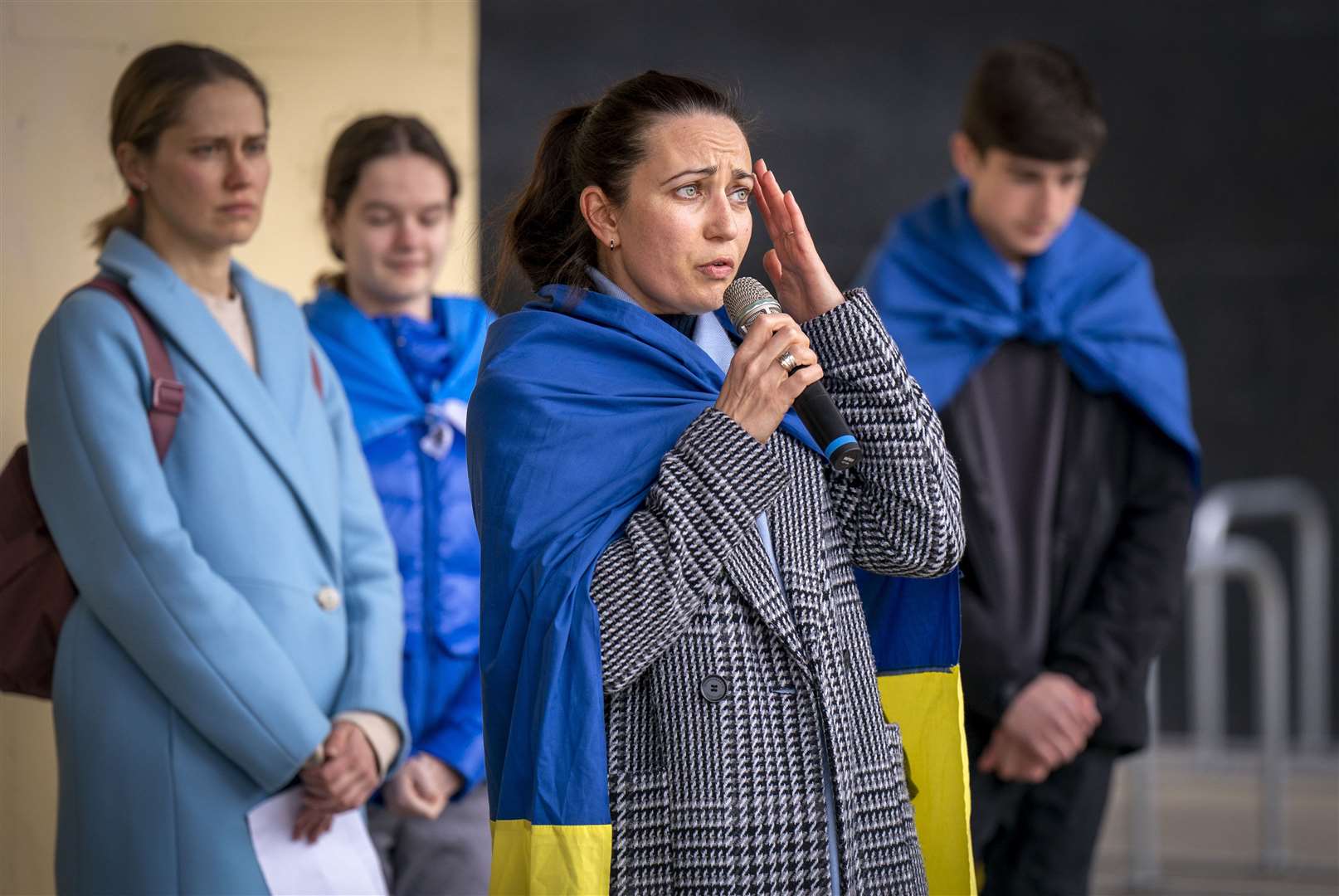 Kateryna Polyakova speaks at the vigil in George Square (PA)