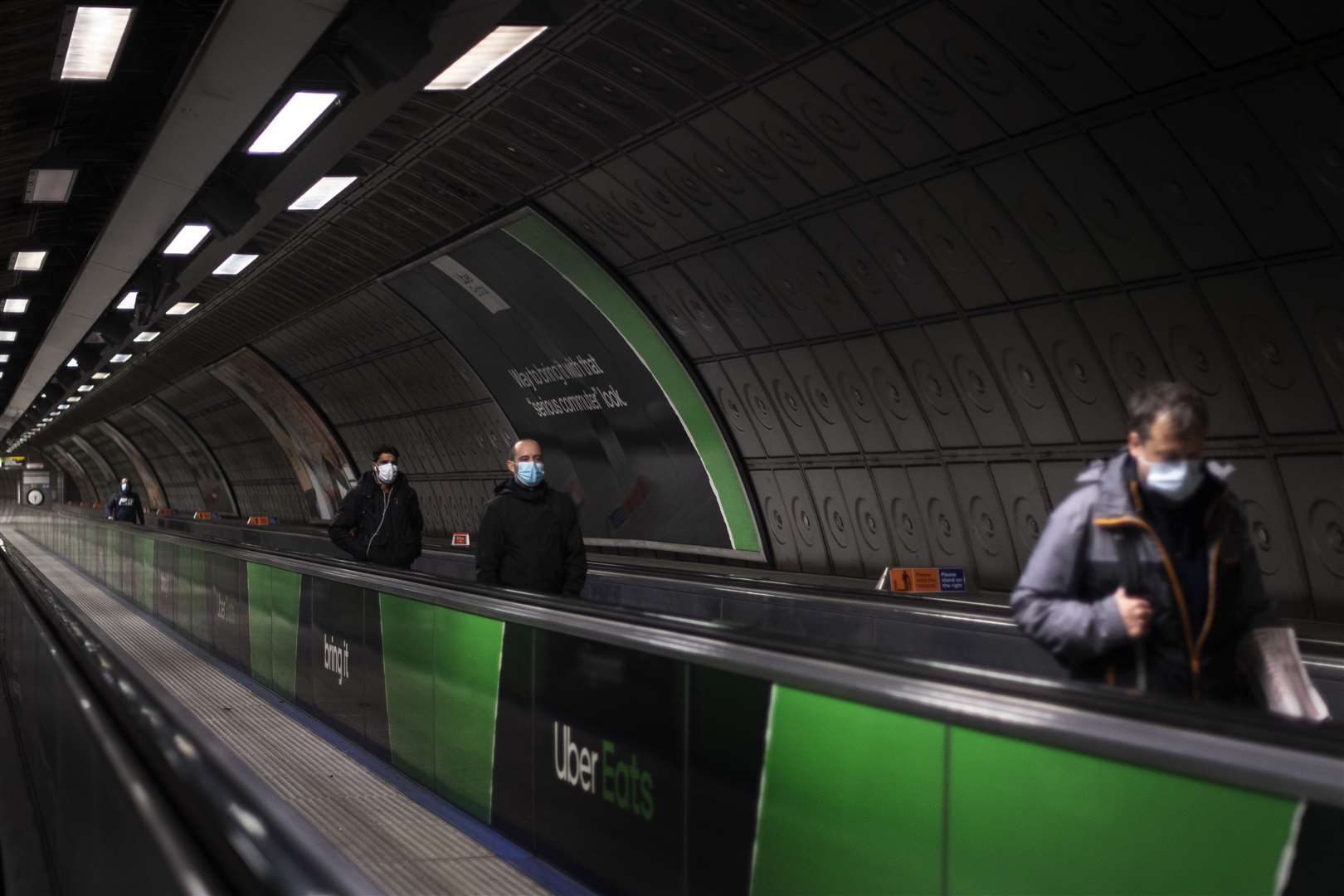 Men wearing face masks at Waterloo Tube station (Victoria Jones/PA)